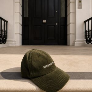 Navy corduroy cap with BECOMING MORE embroidery